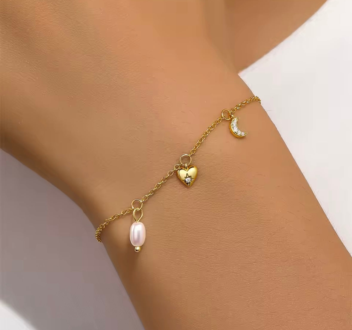 Double star and pearl charmed bracelet / pearl, heart and moon charmed bracelet