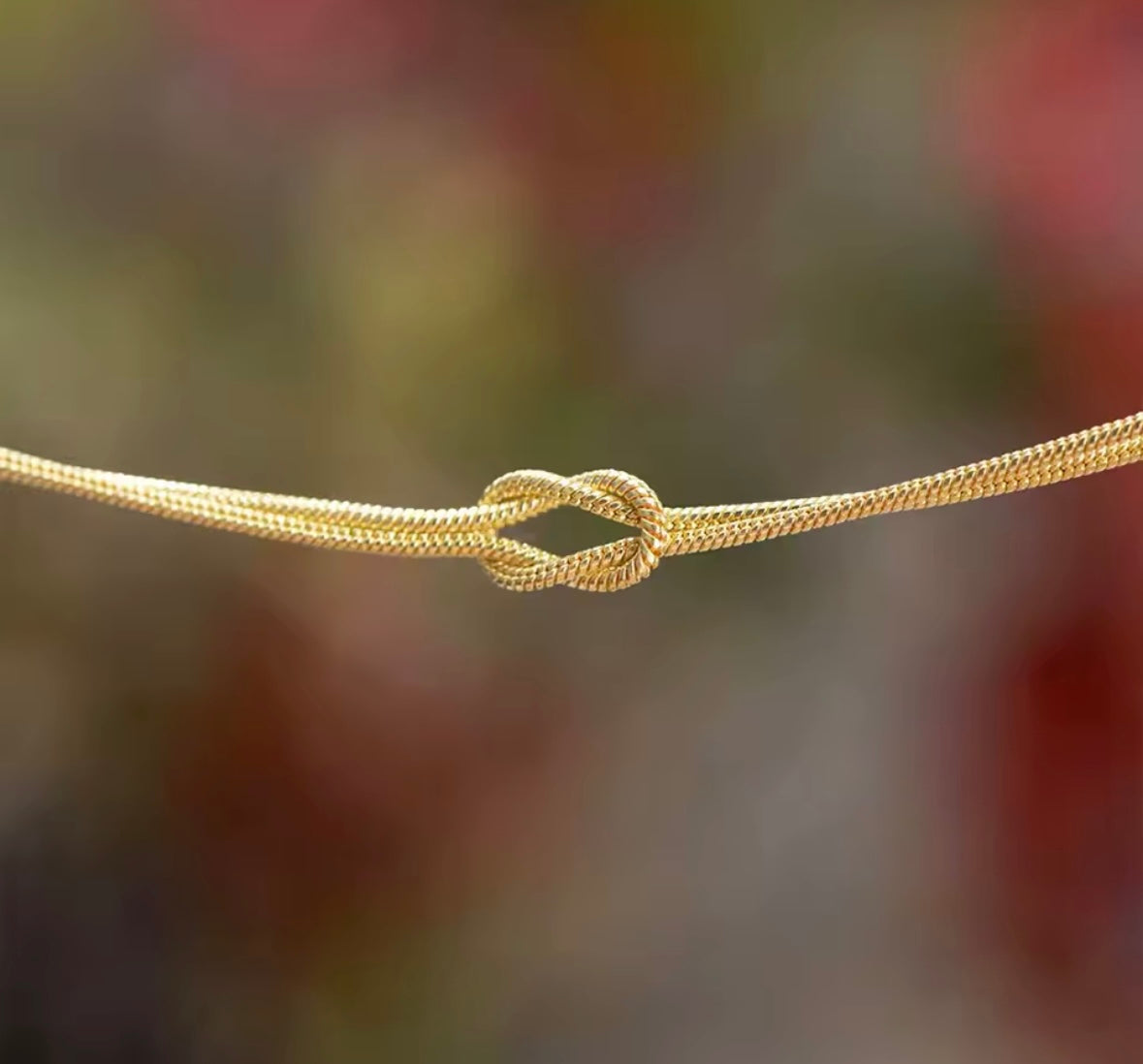 Knotted gold chain bracelet